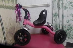 triciclo de niña rosado de metal