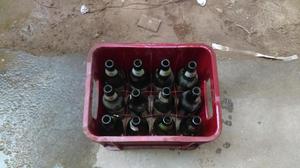 Caja de cerveza mas botellas vacías