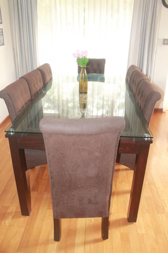 Juego de comedor 8 sillas tapizadas con mesa de vidrio