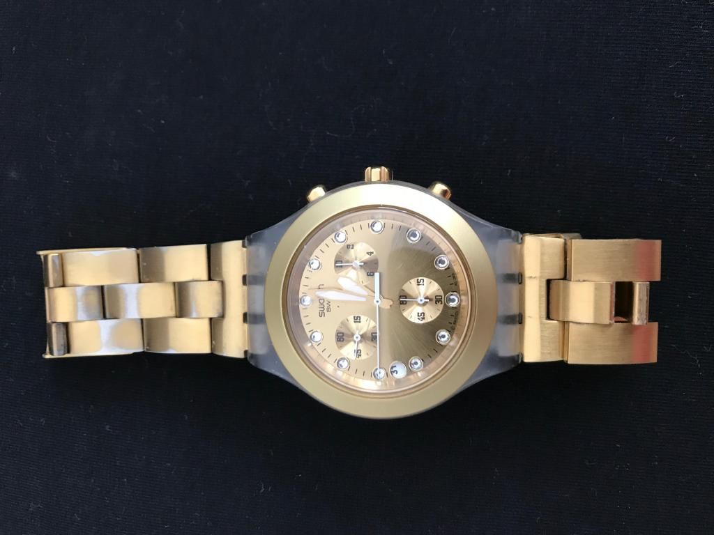 Reloj swatch dorado