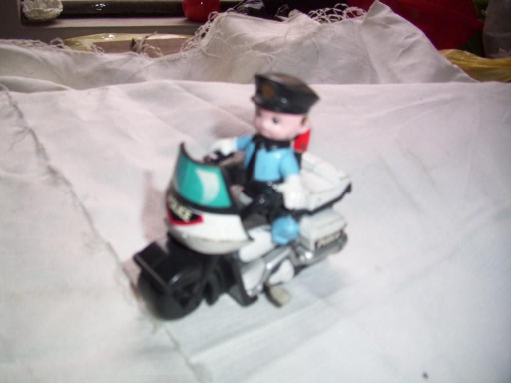 juguete antiguo de policia motorizado