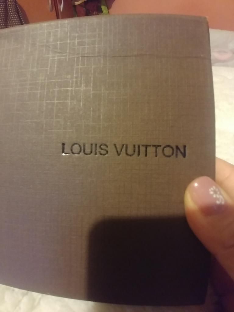 Billeteras Louis Vuitton, Coach
